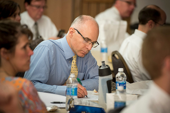 Joel Judkins from the Communications Department, takes notes during a discussion lead by faculty members about different techniques and teaching styles: gamification.