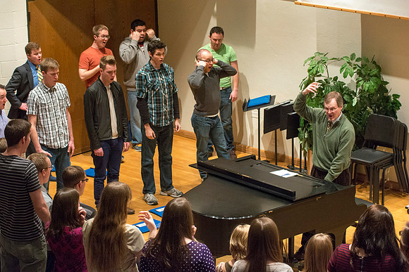 Randall Kempton instructs the talented students who make up the Collegiate Singers at BYU-Idaho.