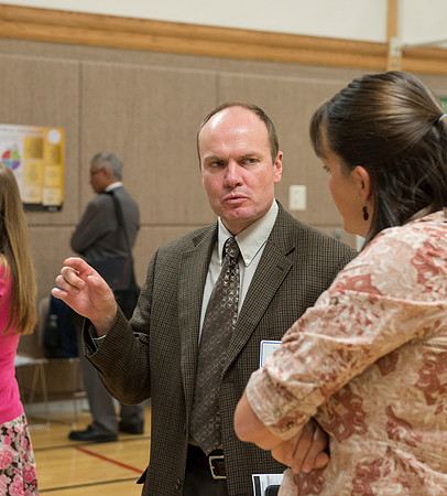 Faculty gather in the Hinckley Building at a Faculty Conference to share and learn from each other at the beginning of the 2013 Fall semester.