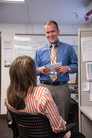 Employees work on developing a better curriculum for online students.