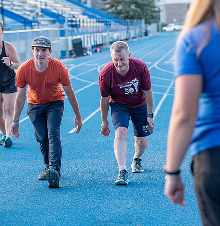 Faculty and community members of BYUI at Speed and Agility triathlete trannings at the stadium.