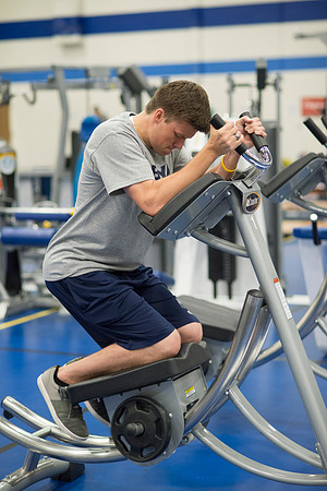 Working the abs on the AbCoaster in the Fitness Center which is located in the old field house portion of the Hart Buiding.
