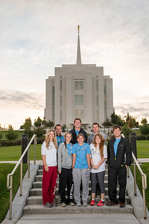 Team members pose by the Rexburg temple before they begin the temple to temple run