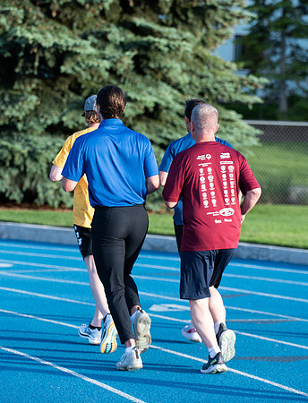 Faculty and community members of BYUI at Speed and Agility triathlete trannings at the stadium.