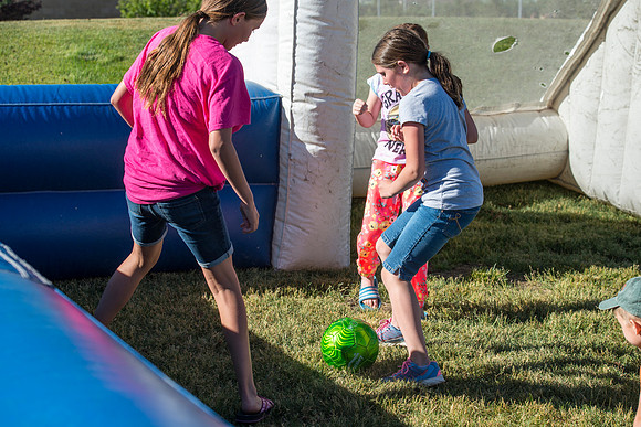 Faculty and their families, as part of the Online Learning & Teaching Conference, join together for dinner and games.