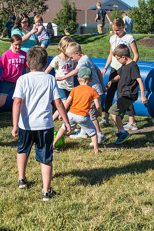 Faculty and their families, as part of the Online Learning & Teaching Conference, join together for dinner and games.