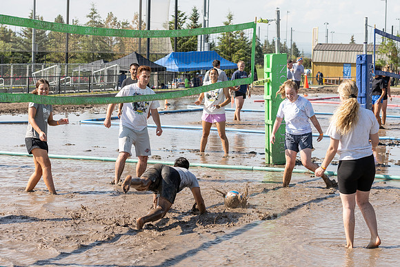 Students gather by the upper fields on the BYU-Idaho Campus to play recreation games, slip 'n' slide, mud volleyball, and try the ropes course.