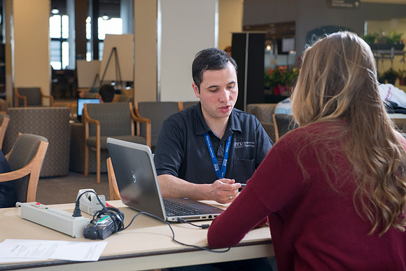 Taylor Nelson is helped by Marius Corca, a student employee from the IT Department.