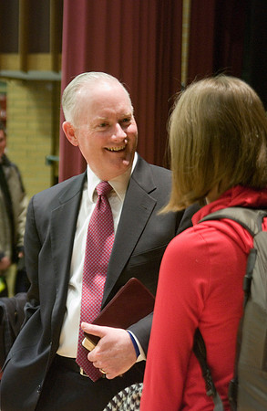 President Kim B. Clark visits with a student after devotional.