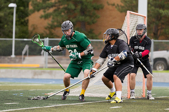 Spartan's Kevin Bosley (24) tests Knight's defender Daniel Calvillo, during Saturday's stormy game at the stadium.