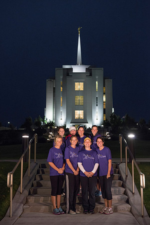 Team members pose by the Rexburg temple before they begin the temple to temple run