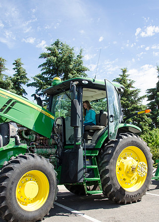 Student sitting in a tractor at BYU-Idaho's first Ag Days