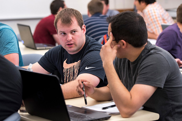 Mechanical Engineering students working together in the Fluid Mechanics course.