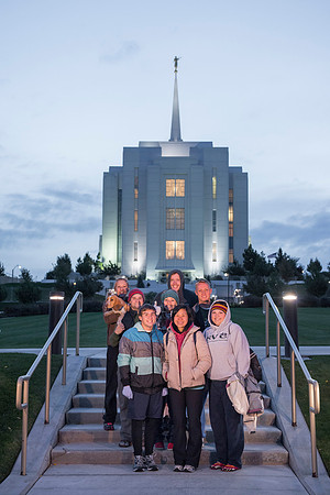 Team members pose by the Rexburg temple before they begin the temple to temple run