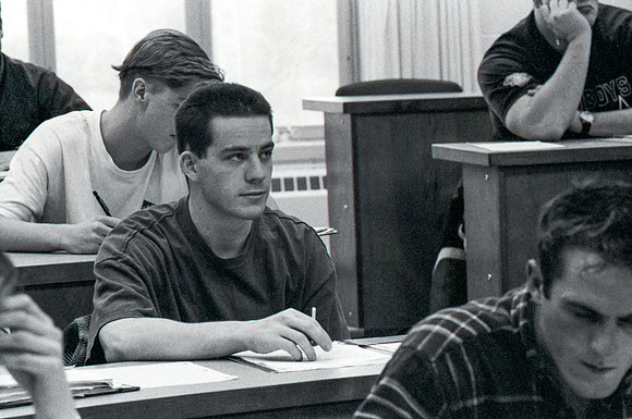 Business teacher, Phillip Packer teaches students in the classroom. December 1995.