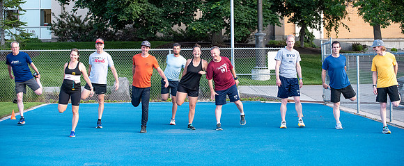 Faculty and community members of BYUI at Speed and Agility triathlete trannings at the stadium.