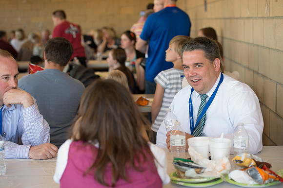 Faculty and their families, as part of the Online Learning & Teaching Conference, join together for dinner and games.