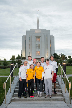 Team members pose by the Rexburg temple before they begin the temple to temple run
