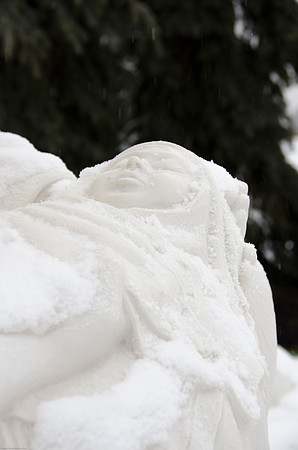 Light snow was faling around the Nativity Decorations outside the Taylor Building.