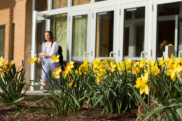 A student leaves the library on a beautiful morning at BYU-Idaho on the first day of class during the 2014 Spring Semester.