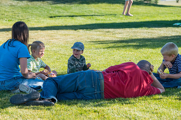 Faculty and their families, as part of the Online Learning & Teaching Conference, join together for dinner and games.