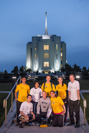Team members pose by the Rexburg temple before they begin the temple to temple run