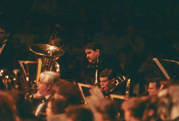 Orchestra focuses on the Conductor.