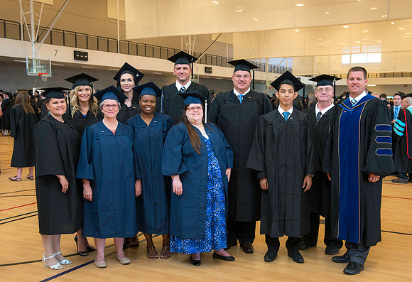 Pathway graduates gather before commencement.
