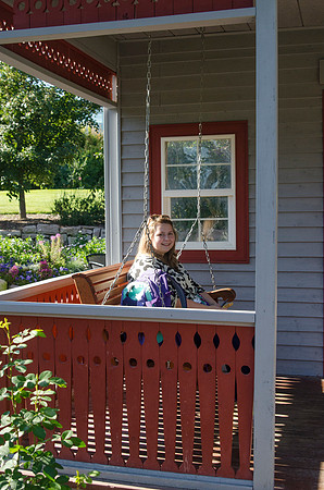 Student enjoying the swing in Patsy's Porch in the Thomas E. Ricks Garden
