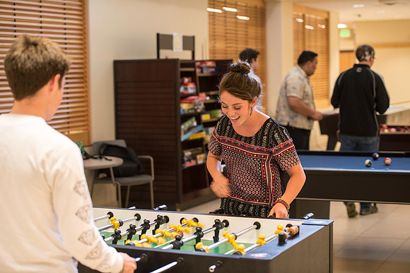 Schooling in Fus'ball in the MC game room.