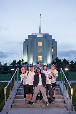 Team members pose by the Rexburg temple before they begin the temple to temple run