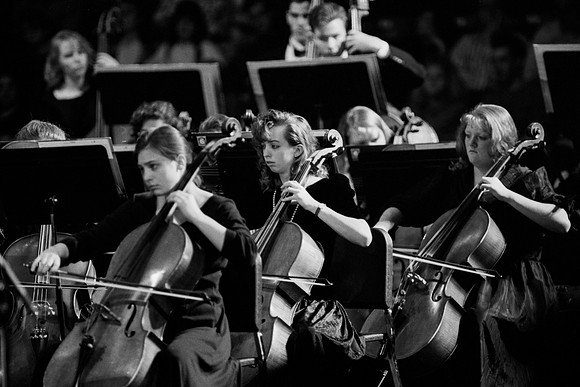 Sacred Music Series: Visions of Eternity. Orchestra members play a piece for the performance. Performance held in the Hart Auditorium of Ricks College.