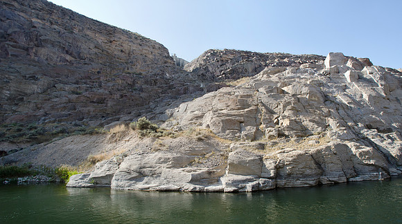 June 5, 1976 the recently built Teton Dam had failed emptying it's 280 foot deep reservoir downstream. The remains of the dam stand as monument to the 11 people who lost their lives.