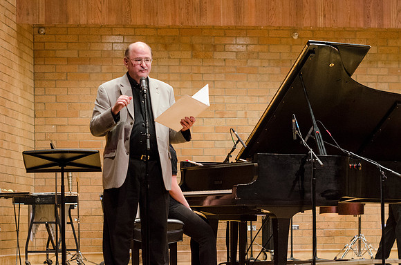 Conductor speaking to audience at the RixStix concert, Spring 2013
