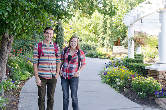 Students walking through the Thomas E. Ricks Building