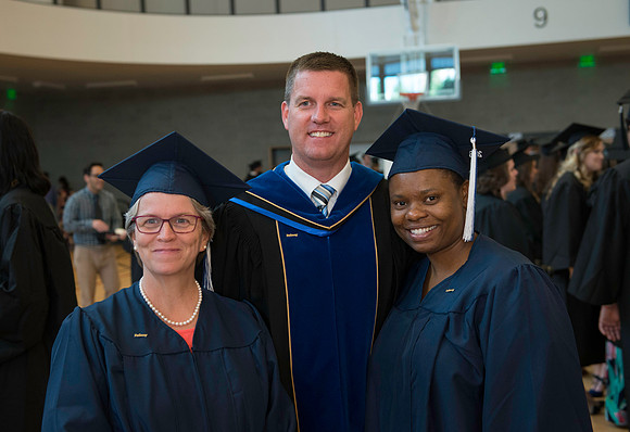Pathway graduates gather before commencement.