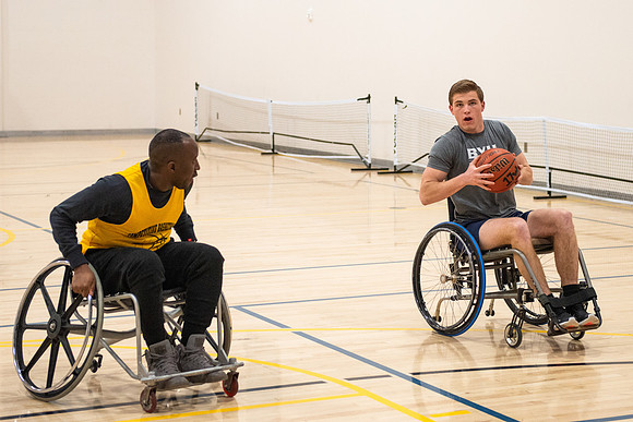 Students participate of Wheelchair Basketball in the Hart Gym.
