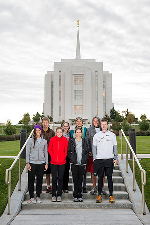 Team members pose by the Rexburg temple before they begin the temple to temple run