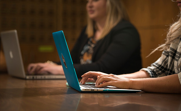 Katelyn Crompton and Rachael Redford study in the basement of the Smith Building.