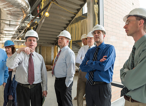 Faculty Members tour the new science building while it is still under construction.