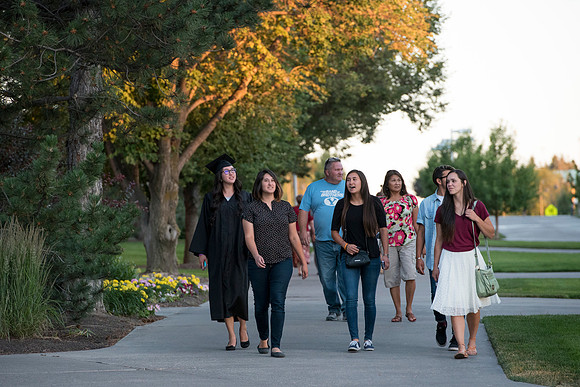 A Brigham Young University-Idaho graduate with her family after graduation. Photo by Ryan Chase