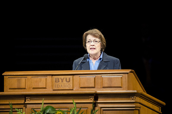 Sister Sue Clark speaking at a devotional.