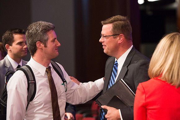 President and Sister Gilbert greet students after the first devotional of the semester.