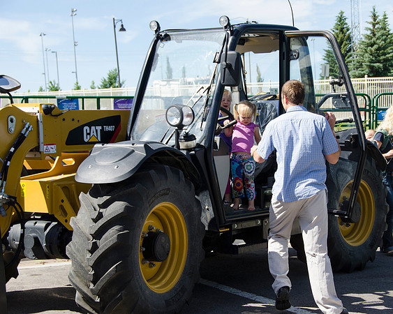 Dad getting his girls from the tractor at BYU-Idaho's first Ag Days