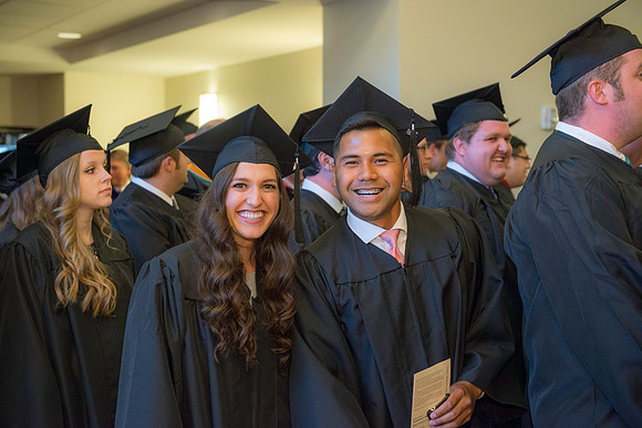 Graduates gather for BYU-Idaho commencement. Graduates march in during the processional.