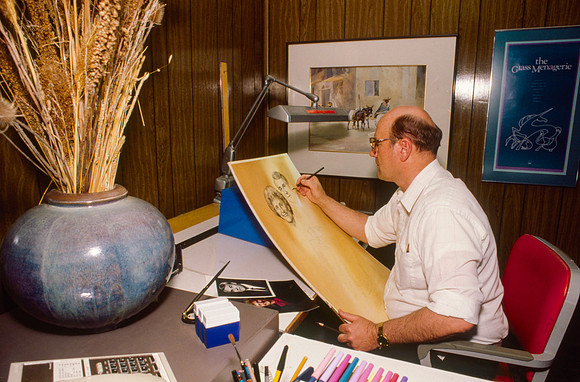 Graphic Artist, Dick Bird, works on an original piece. Illustration for President Joe J. Christensen.
