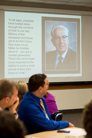 Faculty gather in the Hinckley Building at a Faculty Conference to share and learn from each other at the beginning of the 2013 Fall semester.