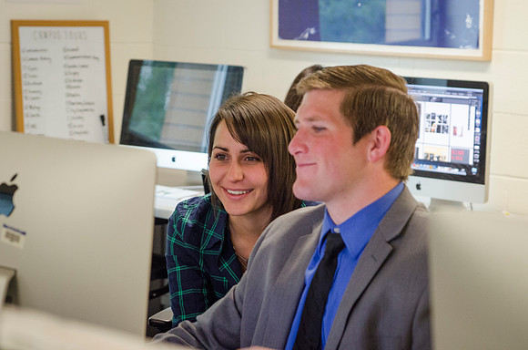 Michael &amp; Mariah working at graphic services on campus