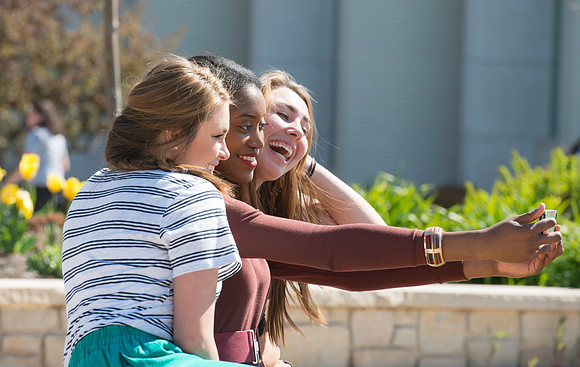 Students enjoy the warmer weather that comes with the change of seasons.