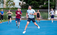 Faculty and community members of BYUI at Speed and Agility triathlete trannings at the stadium.